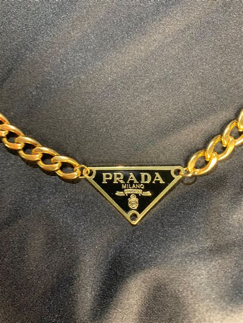 gold Prada necklace